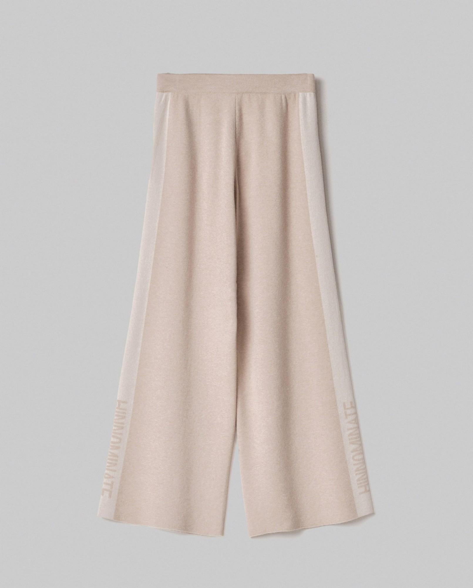 pantalone in maglia a palazzo con bande in contrasto e logo in punto rovescio beige sand hinnominate 